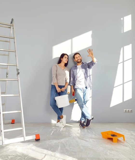Young couple thinking about improvements they can make without violating their rental contract - Cheap renters insurance