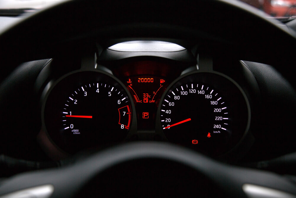 Car odometer displaying a total of 20,000 km