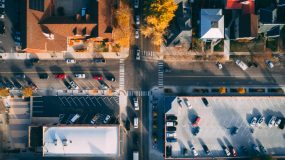 Aerial view of a busy 4-way stop sign intersection, rules of the road, how to handle a 4-way stop.