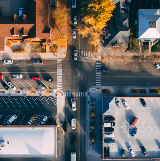 Aerial view of a busy 4-way stop sign intersection, rules of the road, how to handle a 4-way stop.