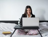 Beautiful young woman working from home with computer laptop - Home, office or freelancer insurance concept.