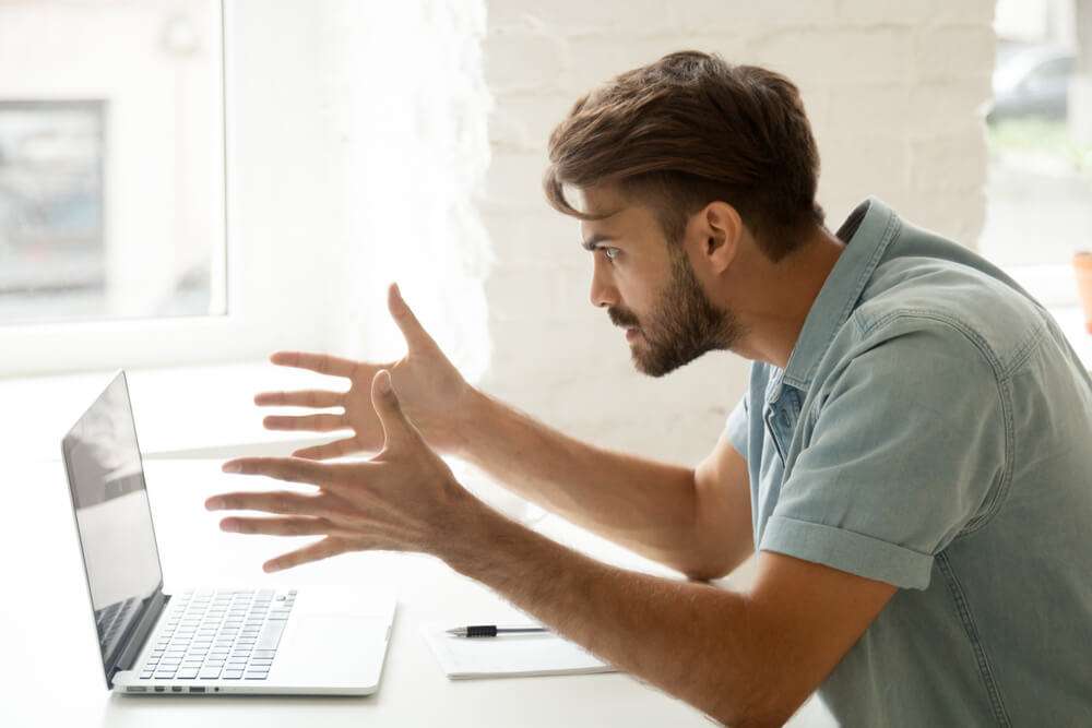 Furious man angry about bad news online or pc software failure, mad work-from-home man having problem with broken laptop, computer crash, user indignant about data loss, common home-based business problems.
