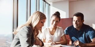 Independent insurance agent goes over couple's insurance policy for renewal and finds ways to save money.