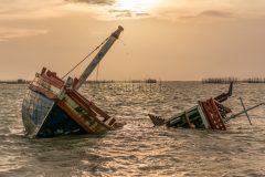 Storm-damaged boat sinking
