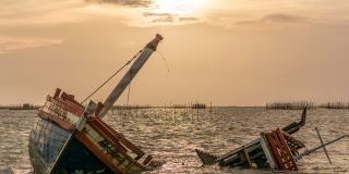 Storm-damaged boat sinking
