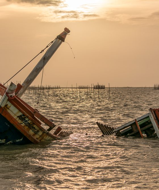 Storm-damaged boat sinking