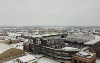 An aerial view of the Kyle Football Field covered in snow in College Station, Texas, USA – College Station, cheap car insurance in Texas
