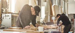 Two men working as wood painters