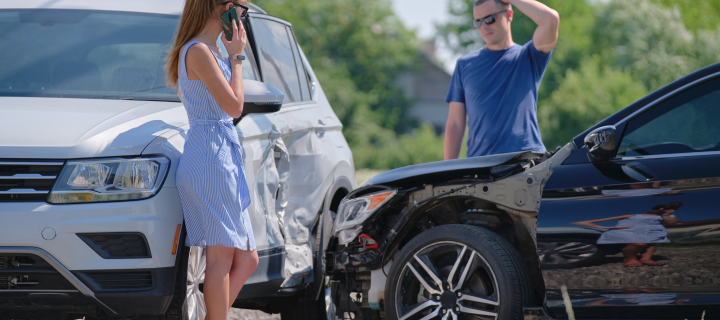 Drivers of smashed vehicles arguing who is guilty in car crash accident on street side. Road safety and insurance concept.