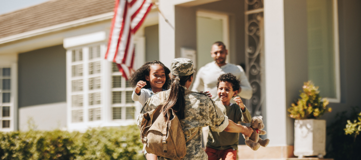 Military woman reuniting with her family.