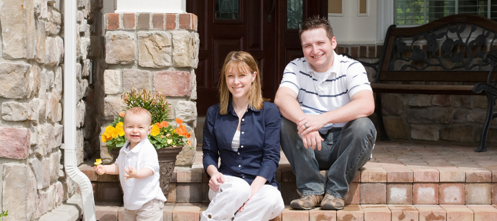 Happy Family of Three Smiling.