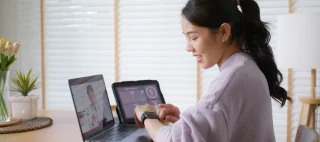 Asia people young woman video call talk chat help guide online at home by AI tele consult telehealth telemedicine app clinic in IoT device collect ECG data heart pulse sleep rate on cloud computing.