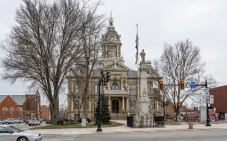 Guernsey County Courthouse, built in 1883 with the Guernsey County Civil War Memorial in front, Cambridge, Ohio – Cambridge, cheap car insurance in Ohio