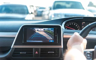 Rear View Monitor for car reverse system. Rear area image showing to driver by video camera at rear area to help for parking and prevent accident. Automotive safety technology equipment.