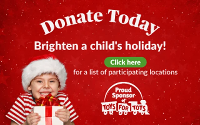 A smiling child wearing a Santa hat and striped sweater holds a wrapped gift in front of a red festive background with text that says “Donate Today – Brighten a child’s holiday! Click here for a list of participating locations,” and the Toys for Tots logo on the right.