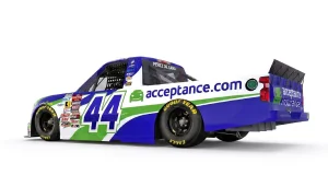 Rear side view of Acceptance Insurance number 44 NASCAR truck showing sponsor branding
