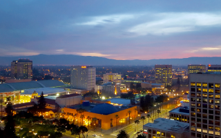 San Jose, Silicon Valley, view of downtown, the Tech Museum, McEnery Convention Center, Silicon Valley, and the Santa Cruz Mountains at sunset.