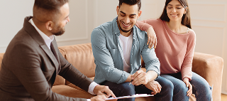 Happy young couple buying new house.